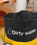 Black RV Hose And Water Tube Storage Bag with 'Dirty Water' text, surrounded by coiled cables, sturdy handle visible, water-resistant.
