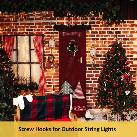 Heavy Duty Black Screw In Cup Hooks One And One Quarter Inch Metal 50 Pack installed holding holiday string lights on brick wall