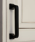 4 Inch Center To Center Square Cabinet Pull Handle Solid Cast Iron With Rust Resistant Black Powder Coat shown on a white cabinet