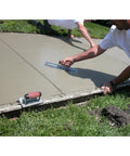 Worker using Pro Grade High Carbon Steel Finishing Trowel 4.75 By 14 Inch For Concrete Masonry and Drywall DuraSoft Handle