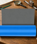 Heavy Duty Roofing Underlayment Tape on a wooden table with a gray background ready for application.