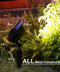 8 Pack 50W Low Voltage Backyard Landscape Spotlight Kit with 3000K warm white flood lights illuminating plants at night.