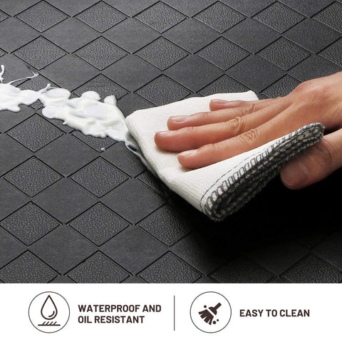 Ergonomic Anti Fatigue Kitchen Floor Mat 4 To 5 Inch Thick Waterproof Non Slip Rug being wiped clean, shows spill resistance.