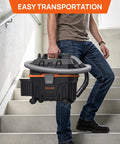 Man carrying Heavy Duty 4 Gallon Wet Dry Shop Vacuum With 5.5 Peak HP Blower Function up the stairs for easy transport.