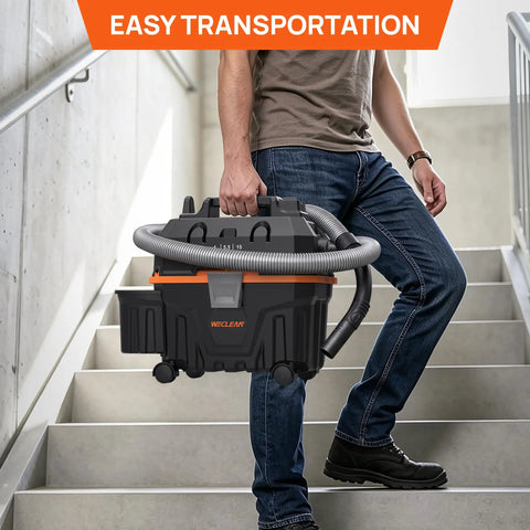 Man carrying Heavy Duty 4 Gallon Wet Dry Shop Vacuum With 5.5 Peak HP Blower Function up the stairs for easy transport.