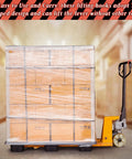 Warehouse pallet jack with stacked shrink-wrapped boxes in background