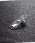 Beefy Plastic Locking Shelf Support Pegs With Smooth Grip Tops For Cupboards Medicine Cabinets And Glass Drink Stands A Top Grade Thirty Piece Cabinet Hardware Fix That Swaps Out Quick And Stays Put, clear plastic peg on black background.