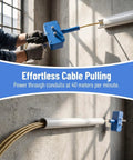 Pro Grade Power Drill Wire Puller With Heavy Duty Steel Body And Twenty Meter Fish Tape Included For Fast Track Conduit Threading No Sweat Cable Installation On Any Project Site, shown being used to pull cable through PVC conduit.