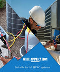 HVAC technician wearing a white hard hat inspecting outdoor air conditioner condenser with hoses