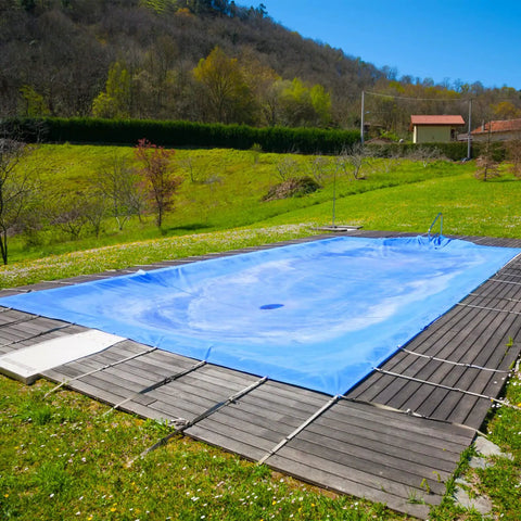Heavy Duty Waterproof Tarp 16x20 Foot Poly Tarpaulin 16 Mil Thick With Metal Grommets covering a pool outdoors