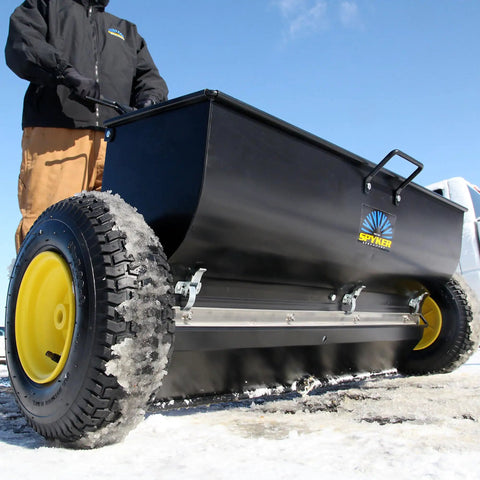 Spyker P70-12010 Commercial Drop Spreader With 120 Lb Hopper, 36 Inch Spread Width, Powder Coated Steel Frame on icy terrain