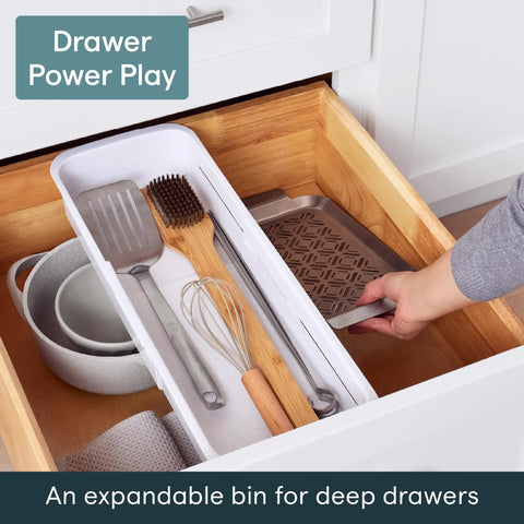 Expandable Sliding Drawer Bin For Kitchens Sets The Bar Inside Deep Drawers in speckled white, organized kitchen utensils in a deep drawer.
