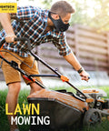 Man wearing Dust Face Mask With Extra Activated Carbon Filters And Air Valves For Woodworking mowing lawn with gas mower.