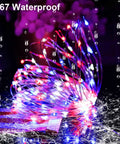 Patriotic Solar Fairy String Lights 2 Pack With 200 LED 66 Ft Red White Blue Outdoor Waterproof shown in rainy setting