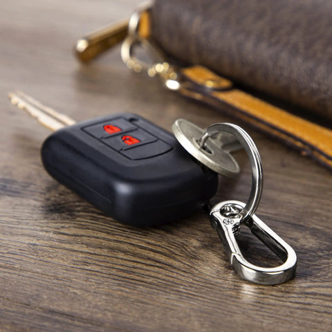 4 Piece Multipurpose Keychain Clip Set With Secure Zinc Carabiner And Steel Keyring on table near car key and wallet