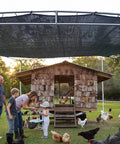 Heavy Duty Shade Cloth 70 To 90 Percent Sunblock Net covering chicken coop and surrounding area outdoors