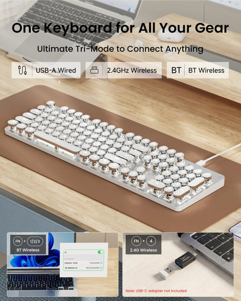 Wireless Typewriter Style Mechanical Keyboard With Clicky Blue Switches And Crisp White Backlighting To Give Your Desk A Kickin Retro Vibe And Legit Smooth Typing Sessions, displayed on a wooden desk with tri-mode connectivity options.