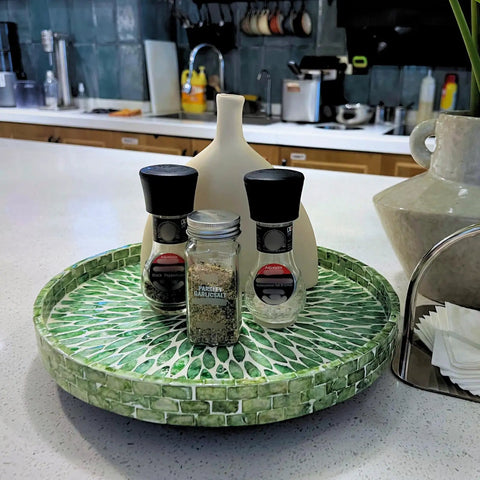 Next Level 12.5 Inch Wooden Lazy Susan With Mother Of Pearl Inlay, Super Heavy Duty Spinning Turntable Serving Tray For Kitchen Islands Or Cookouts, Straight Up A Showstopper featuring spices on a green inlaid tray.