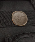 Close-up of leather logo on New Improved Travel Bag Case for Nespresso Essenza Mini and Pixie with Extra Interior Padding