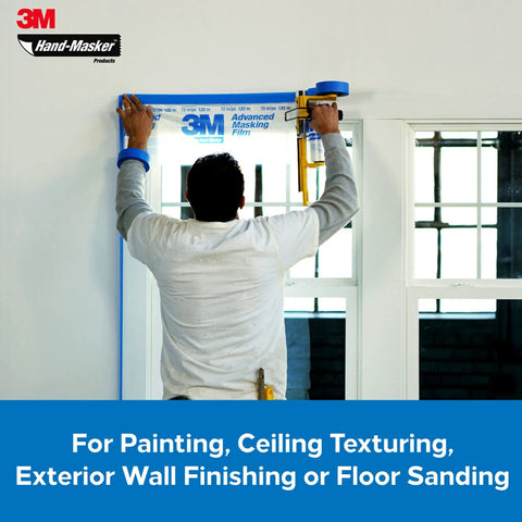Person using Hand Masker Painter Tape And Masking Film Dispenser Kit For Fast Masking Prep with a 12 inch blade on a window frame.