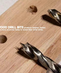 Upgraded Cabinet Hardware Jig Featuring Micro Adjustment Slider For Dead On Drawer Pull Template Alignment No Fuss Drill Bit Storage Slick Woodworking Calibration Tool, close-up of wood drill bits on plywood.