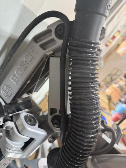 Side view of Custom 3D Printed Dust Collection Attachment For 12 Inch Glide GCM12SD Miter Saw That Delivers Dust Busting Power Easy Install Universal Fit Durable Black Finish installed.