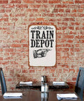 Train Depot Aluminum Wall Decor 12x8 Inch, Railroad Station Themed Wall Art on brick wall, perfect for bar or patio.