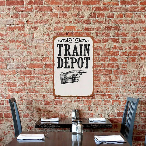 Train Depot Aluminum Wall Decor 12x8 Inch, Railroad Station Themed Wall Art on brick wall, perfect for bar or patio.