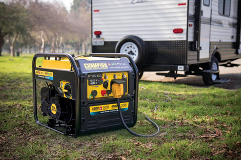 4500 Watt Dual Fuel Open Frame Inverter Generator With Electric Start For RVs And Camping next to parked RV on grass