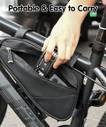 Hand placing Tire Repair Tool Kit With 16-In-1 Multitool Levers Patches And Metal Polish into bike bag
