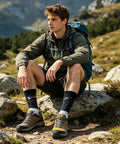 Man sitting on rocks wearing Crazy Colorful Mens Dress Socks For Men Size 8 To 12 Crew Length Dope Patterned Dress Socks