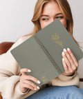 Woman holding a Stylish Aesthetic Spiral Notebook Set Of 3 For Women with Cute College Ruled 8x6 Journals, flower design cover visible.