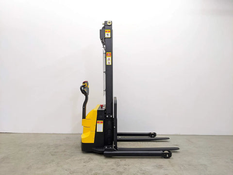 Built Tough Electric Wide Leg Pallet Stacker Heavy Lifter With 2204 Lbs Capacity And 130 Inch Lift Featuring Maintenance Free Battery 110V Us Plug Speed Control And Three Year Warranty Yellow side view showing lifting forks and control handle.