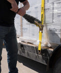 Heavy Duty Ratchet Strap Tightening Handle For 2 Inch 3 Inch And 4 Inch Straps Black Polycarbonate Grip in use on flatbed trailer