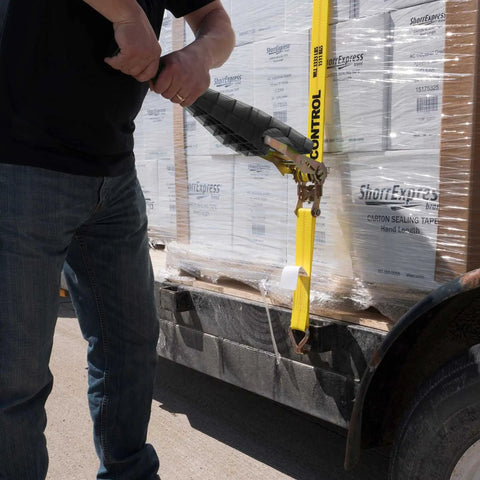 Heavy Duty Ratchet Strap Tightening Handle For 2 Inch 3 Inch And 4 Inch Straps Black Polycarbonate Grip in use on flatbed trailer