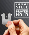 Hand holding Claw 25 Lb Drywall Picture Hanger Set With Spot Markers No Studs Needed Heavy Duty Hardened Steel For Mirrors And Large Art