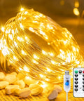 Twinkle Fairy Lights 33 Ft USB Plug In String Lights With Remote And Timer 100 LED Waterproof Wire coiled with remote on wood