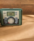 Easy Set Logic 12 Zone Outdoor Sprinkler Timer with Locking Cabinet for Indoor Outdoor Installations showing digital display and dial.