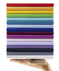 Top Shelf Hardcover Lined Journal Notebook With College Ruled Pages For Your Daily Grind And Heavy Note Taking stacked in various colors.