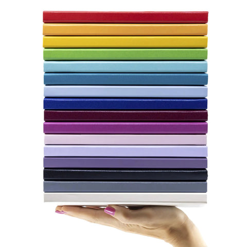 Top Shelf Hardcover Lined Journal Notebook With College Ruled Pages For Your Daily Grind And Heavy Note Taking stacked in various colors.