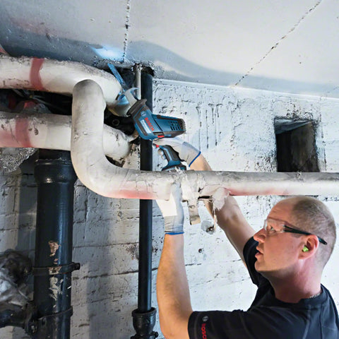 Professional Grade Cordless Saber Saw Delivering Smooth Operator Performance And Badass Cutting Power For Heavy Duty Renovations And Real Deal Work On Any Job Site cutting through pipes.