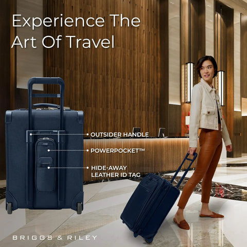 Person pulling 21 Inch Expandable Carry On Luggage With Wheels Softside 2 Wheel Roller Travel Bag For Men And Women Self Repairing Zipper Navy.