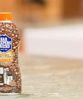 Coffee Maker Cleaner That Kicks Oily Residue, Tannins, And Stains For Single Cup And Auto Drip Machines bottle on counter