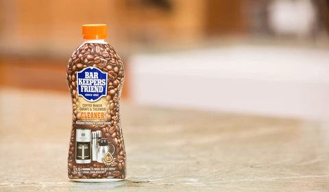 Coffee Maker Cleaner That Kicks Oily Residue, Tannins, And Stains For Single Cup And Auto Drip Machines bottle on counter