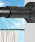 Close-up of No Drill Tension Curtain Rod Set 51 To 168 Inches for indoor or outdoor use, black rod against blue sky.