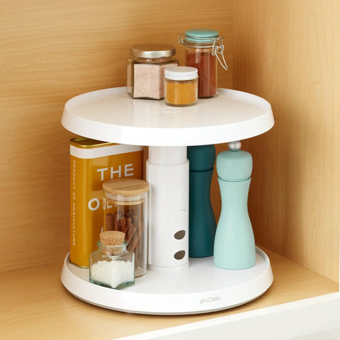 Game Changer Two Tier Height Adjustable Lazy Susan Turntable With Smooth 360 Swivel For Kitchen Cabinet And Pantry Organization And Quick Access Storage In White showcasing spices, containers, and bottles on a shelf.