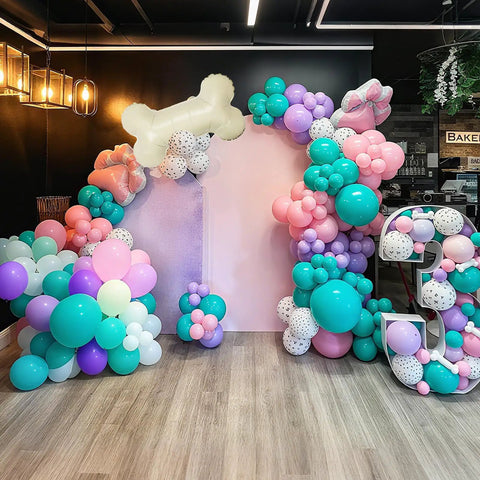 Doggo Approved Paw Print Party Balloon Kit With Pink Teal Purple Hot Pink Paw Print Balloons And Bone Foil Balloon For Girls Puppy Themed Birthday Or Baby Shower Decor displayed in an arch