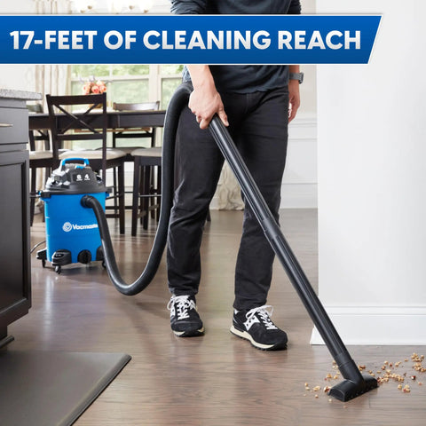 Person using Heavy Duty 8 Gallon Wet Dry Shop Vac Delivering 75 Cfm with 17-foot hose on hardwood floor.