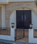 Outdoor post light built to last weatherproof lantern with oil rubbed bronze finish and tempered seeded glass on a patio.