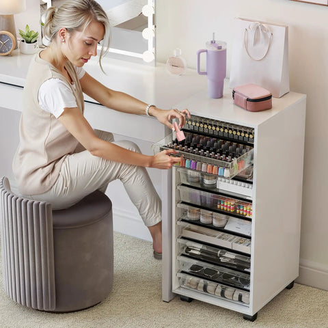 Woman using Rolling Storage Cart With 10 Large Clear Drawers, Mobile Makeup And Craft Organizer On Wheels in a beauty room.